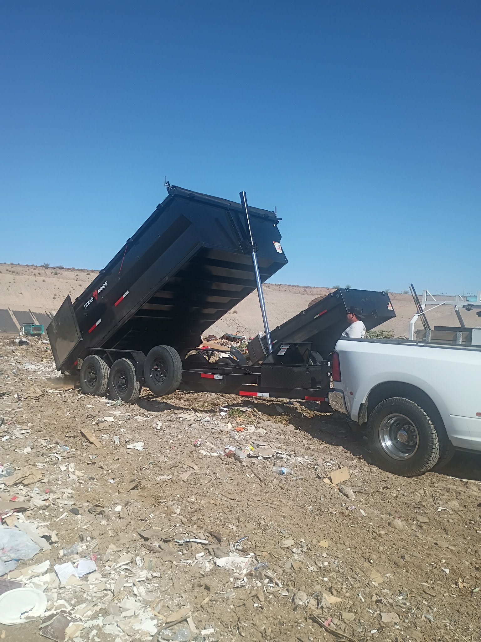 Dump trailer unloading debris