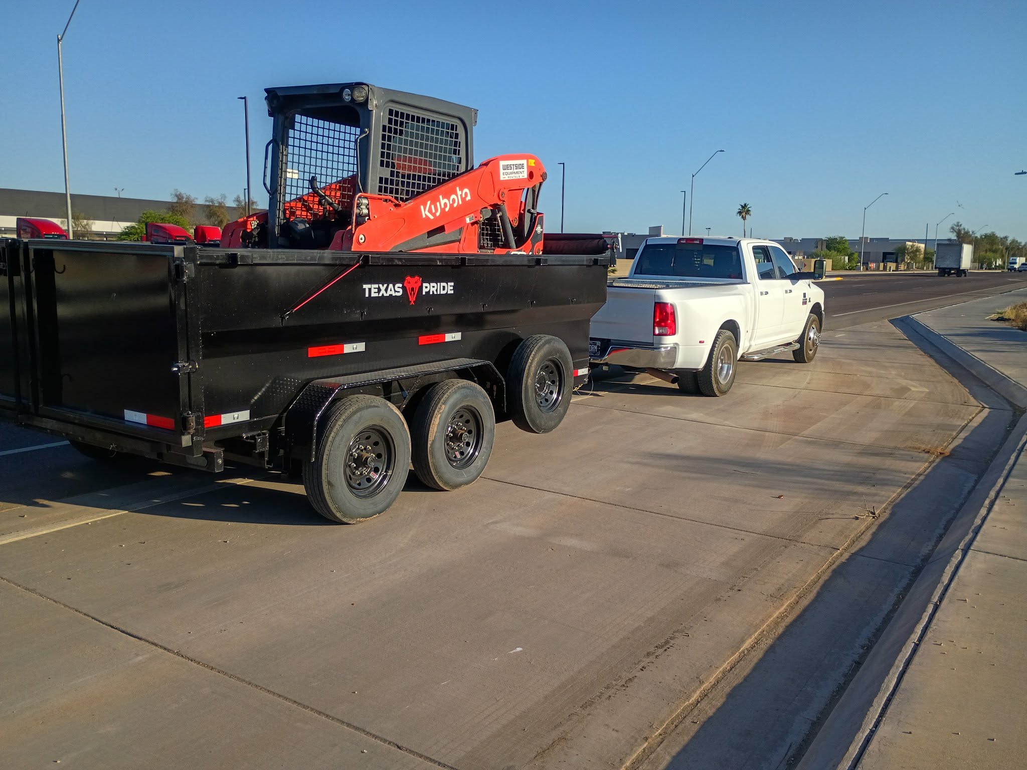 JF Junk N Haul truck with dump trailer and skid steer